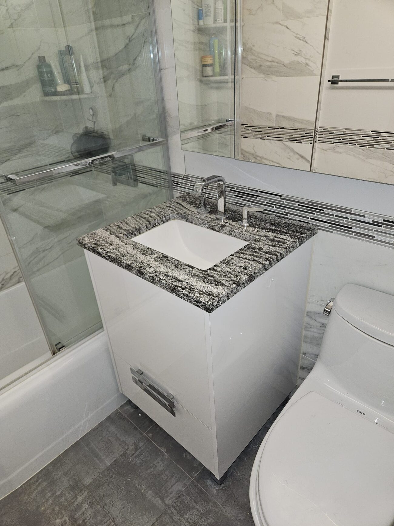Marble tile bathroom remodel in a Manhattan apartment