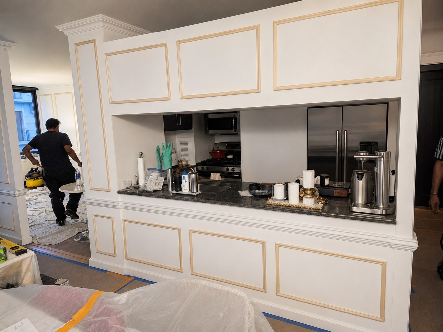 Custom picture-frame wall molding on a kitchen pass-through in a New York City apartment — FF Solutions
